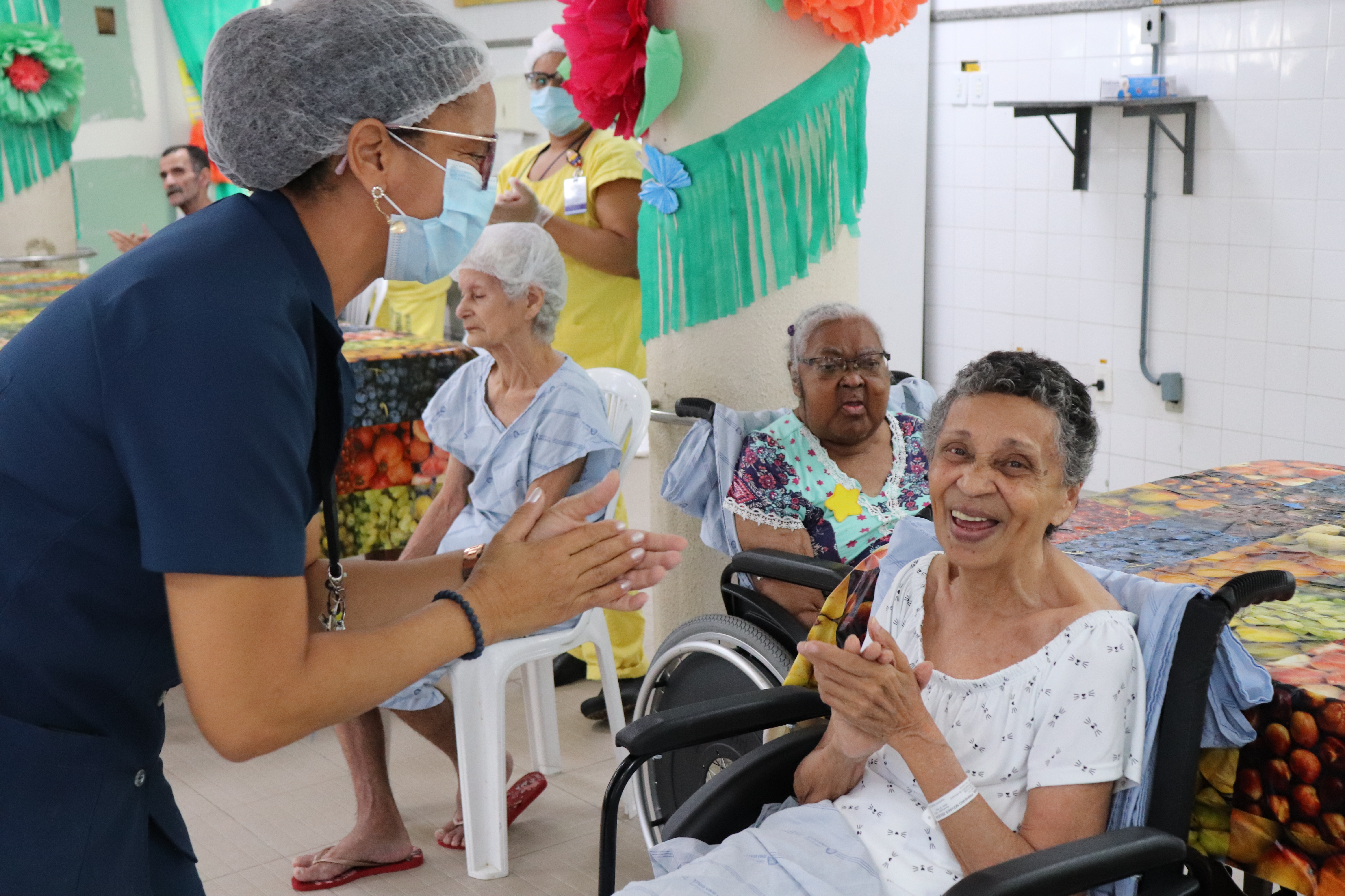 Photos of OSID members helping patients.