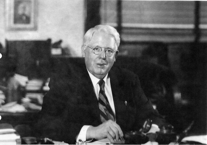 Melvin Jones sitting at his desk